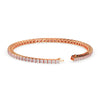 Rose gold bracelet with clear stones on a white background