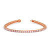 Rose gold bracelet with diamonds on a white background