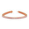 Rose gold bracelet with clear gemstones on a white background