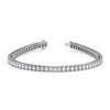Diamond bracelet with emerald-cut stones on a white background