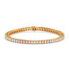 Gold bracelet with diamond accents on a white background