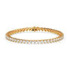 Gold bracelet with diamond accents on a white background