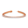 Rose gold bracelet with diamonds on a white background