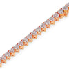 Rose gold bracelet with heart-shaped diamonds on a white background