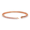 Rose gold bracelet with diamond accents on a white background