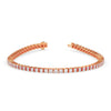Rose gold bracelet with diamond accents on a white background