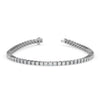 Silver tennis bracelet featuring 4 carats of princess cut diamonds in a classic line setting on a wite background