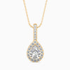 Gold and diamond teardrop pendant on a white background