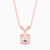 Rose gold necklace with a round pendant on a white background