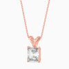 Rose gold necklace with a clear gemstone on a white background