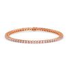 Rose gold bracelet with diamonds on a white background