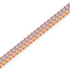 Diamond bracelet with rose gold setting on a white background