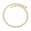 Gold bracelet with clear beads on a white background