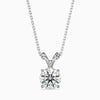 A round cut diamond pendant with a chain, set against a white background.