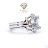 Silver ring with a large diamond and smaller diamonds on a white background, featuring Cheriva Jewels logo.