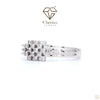 White gold engagement ring with a central lab-grown diamond surrounded by a sparkling halo setting
