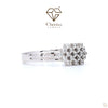 White gold engagement ring with a central lab-grown diamond surrounded by a sparkling halo setting