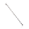 Silver bracelet with clear stones on a white background