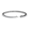 Silver tennis bracelet set with lab-grown diamonds in a classic line design on a white background