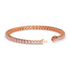 Rose gold bracelet with diamonds on a white background