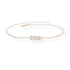 Rose gold bracelet with three diamonds on a white background