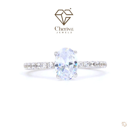 Oval cut diamond halo engagement ring in gold.