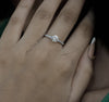 Diamond ring on a hand with 'cheriva jewels' branding.
