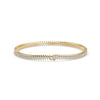 Gold bracelet with diamonds on a white background