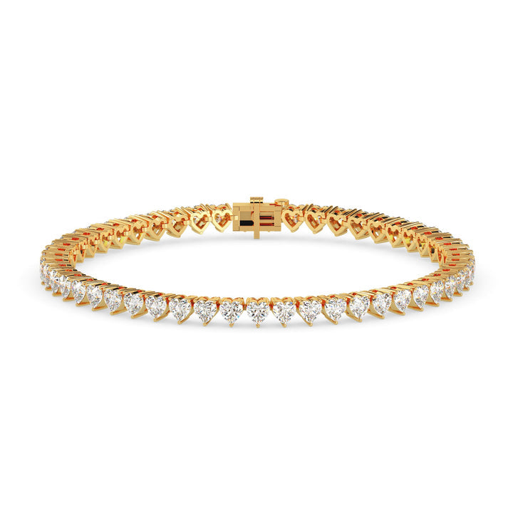 Gold bracelet with diamond accents on a white background