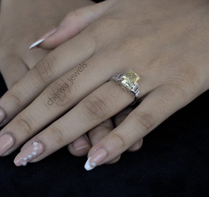 Close-up of a hand wearing a diamond ring