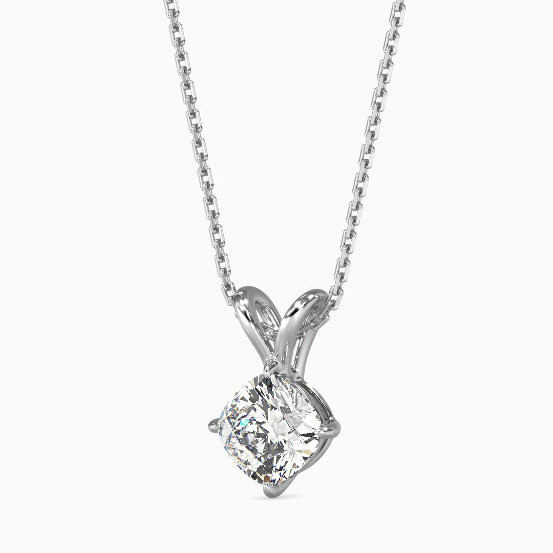 Diamond pendant on a chain against a white background