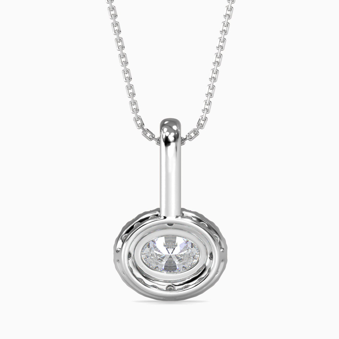 Silver pendant with a clear gemstone on a white background