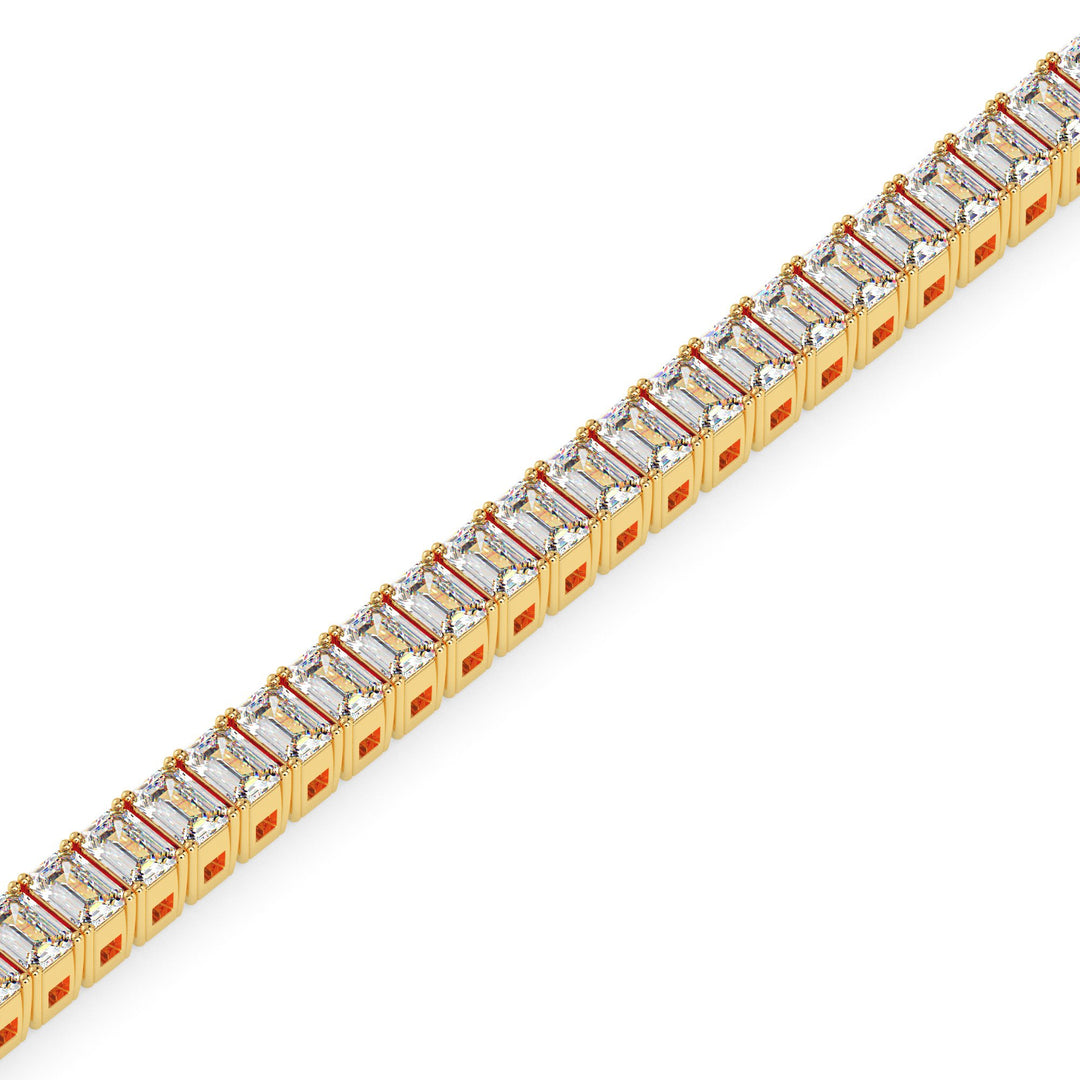 Gold bracelet with clear gemstones on a white background