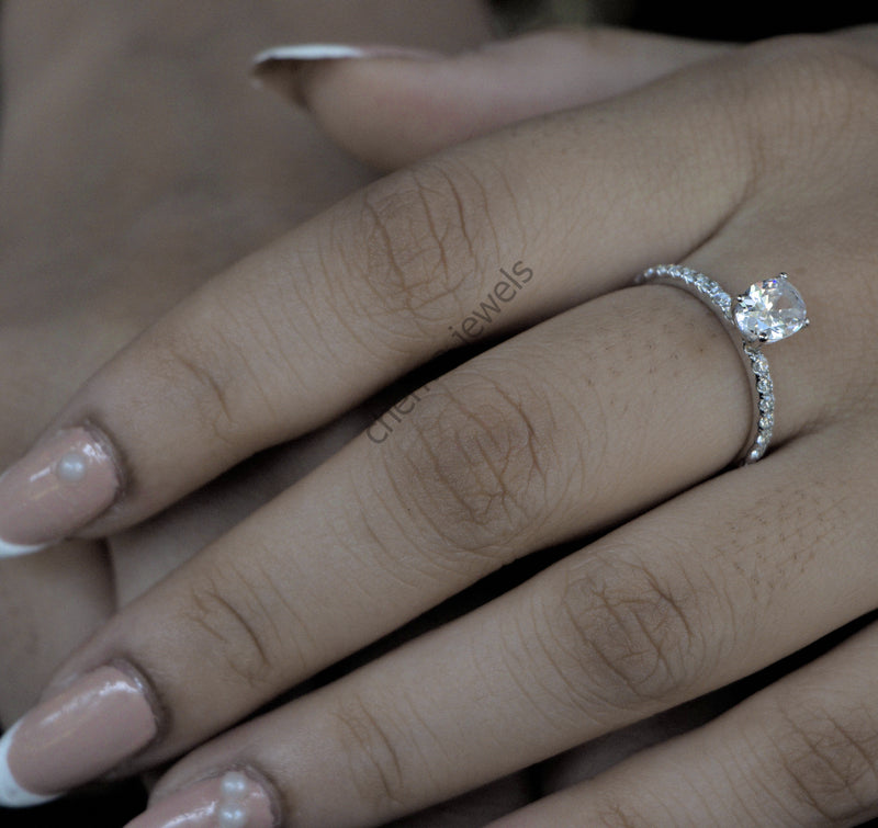 Solitaire Accent Engagement Ring in Oval Cut Diamond