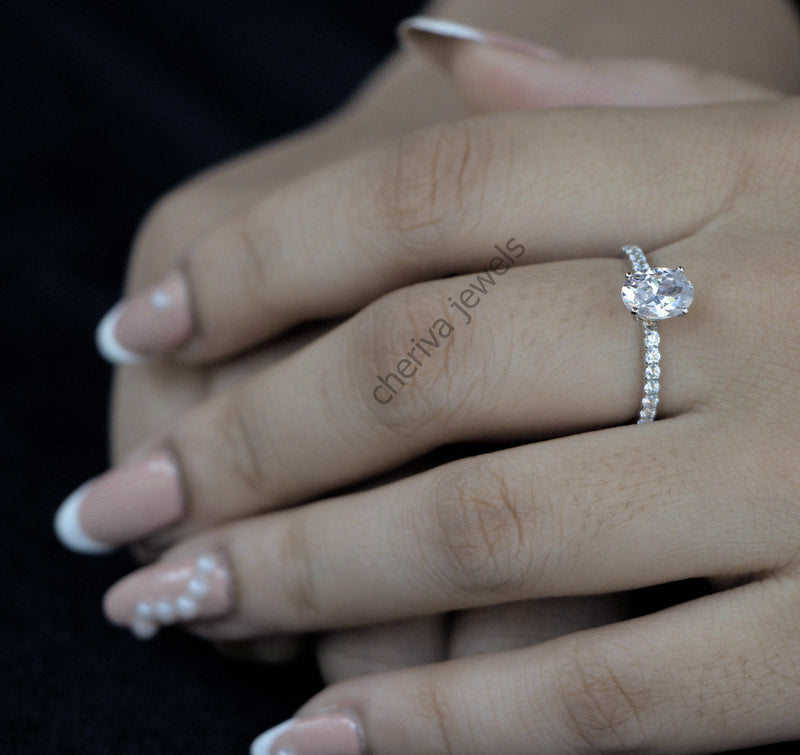 Solitaire Accent Engagement Ring in Oval Cut Diamond
