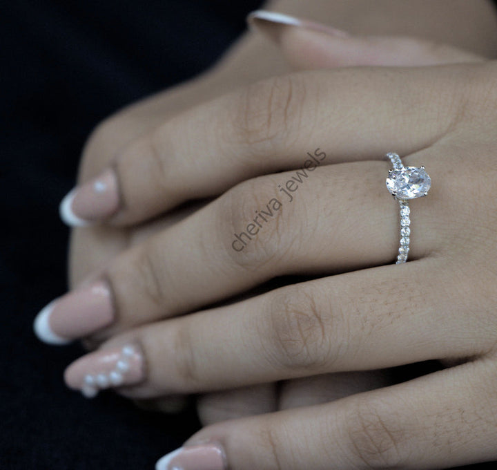 Solitaire Accent Engagement Ring in Oval Cut Diamond