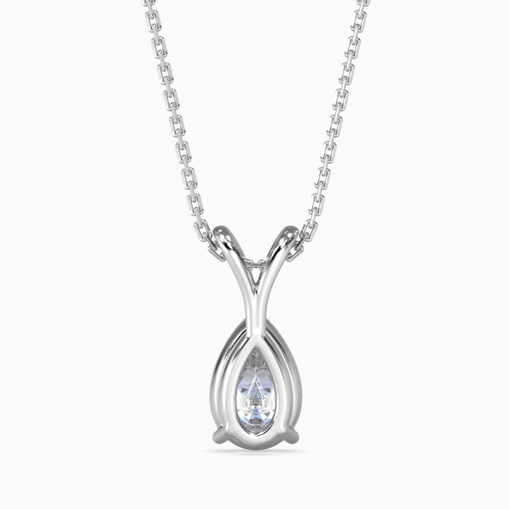Silver necklace with a teardrop-shaped pendant on a white background
