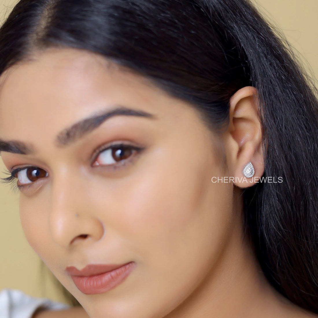 Round Cut Halo Stud Earring in Pear Shape