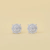 Pair of diamond earrings on a beige background