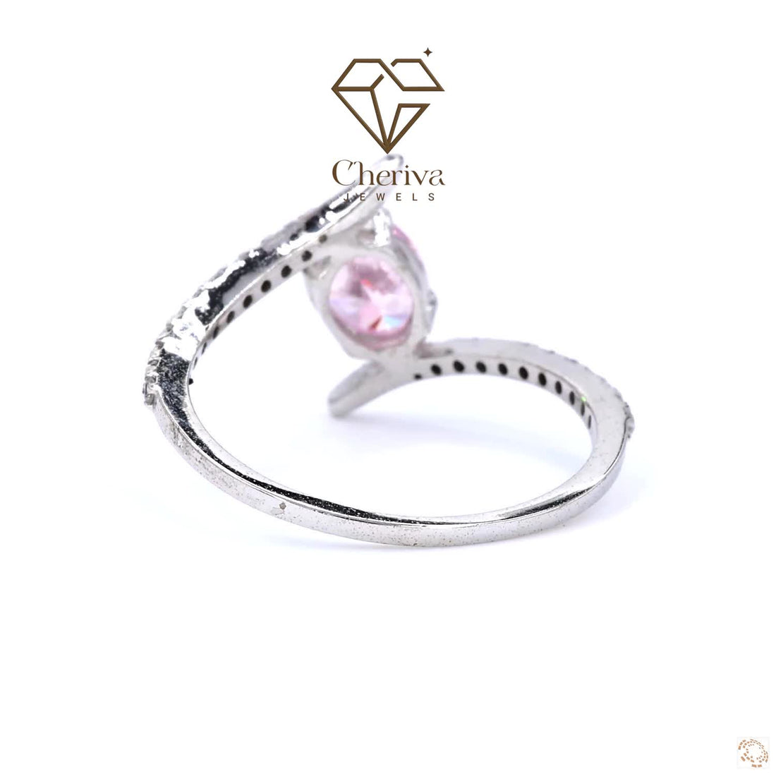 Silver ring with a pink gemstone on a white background, featuring the Cheriva Jewels logo.