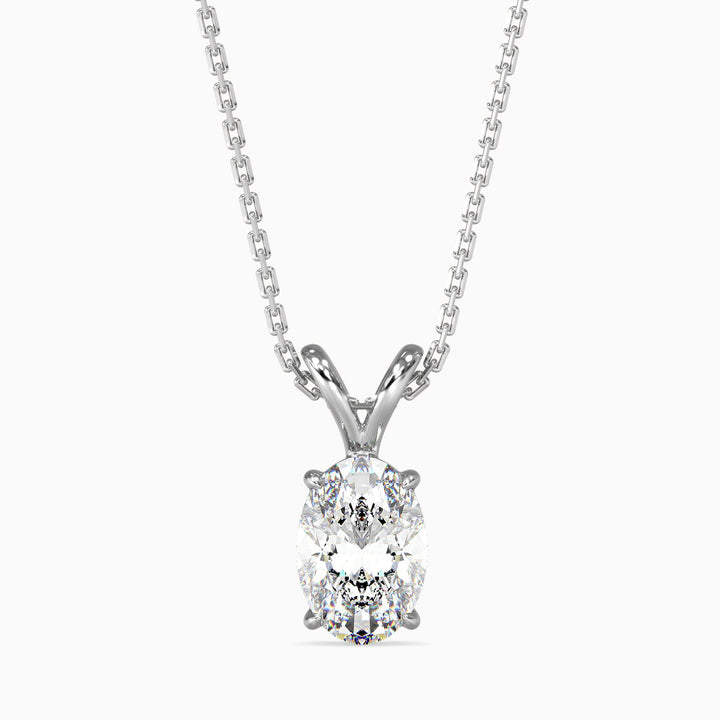 An oval cut diamond pendant necklace with a solitaire setting on a white background.