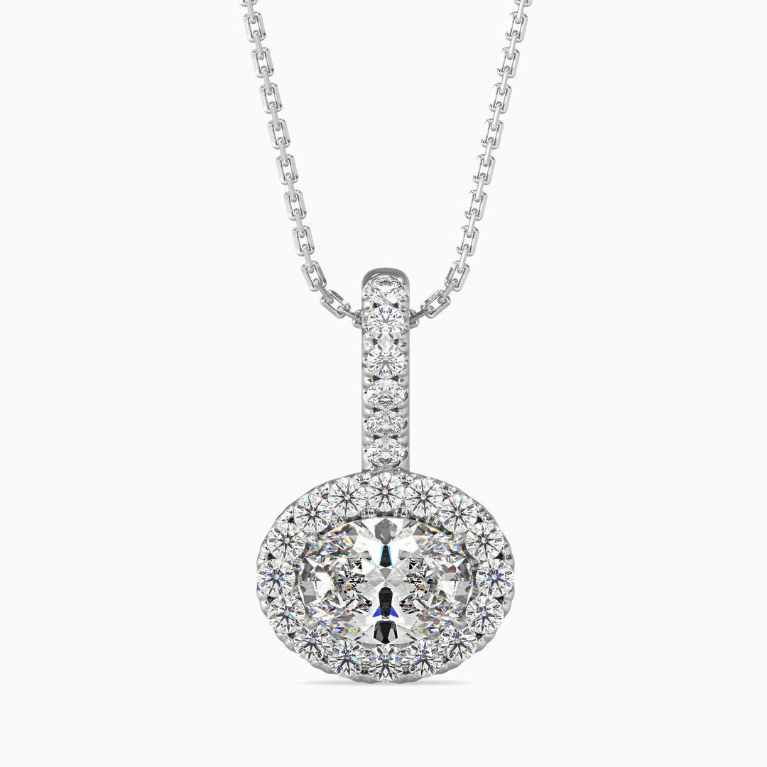 An oval cut halo pendant with a diamond encrusted setting on a white background.