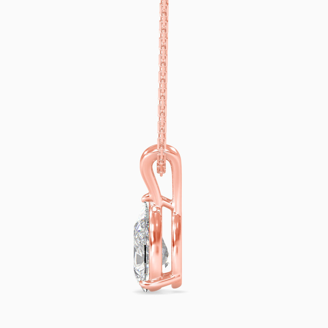 Rose gold necklace with a diamond pendant on a white background