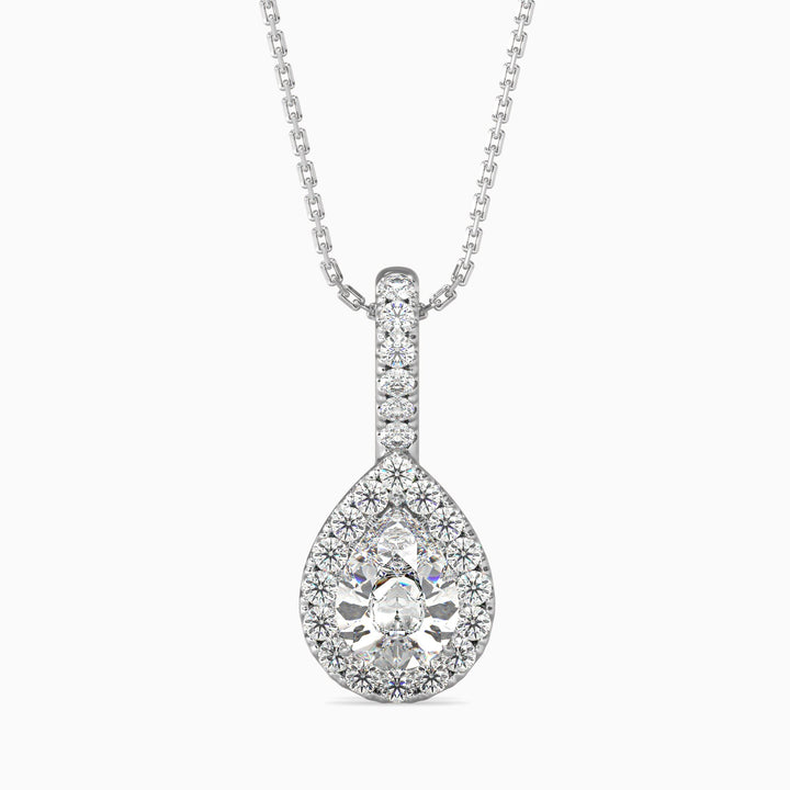 A pear cut halo pendant with a diamond encrusted setting on a white background.