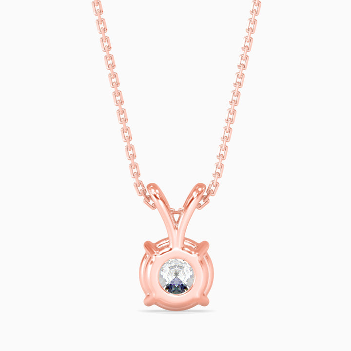 Rose gold necklace with a round pendant on a white background