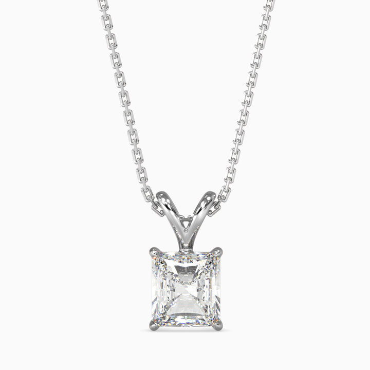 A radiant cut diamond pendant with a colorless stone set in a white gold or platinum chain.