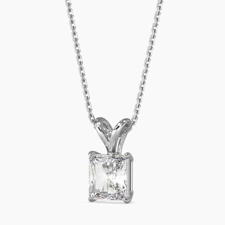 Diamond pendant on a chain against a white background
