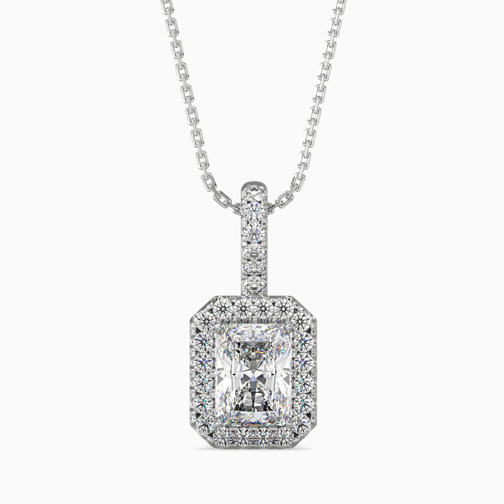 A radiant cut halo pendant with a central diamond surrounded by smaller diamonds, set in a white gold or silver chain.