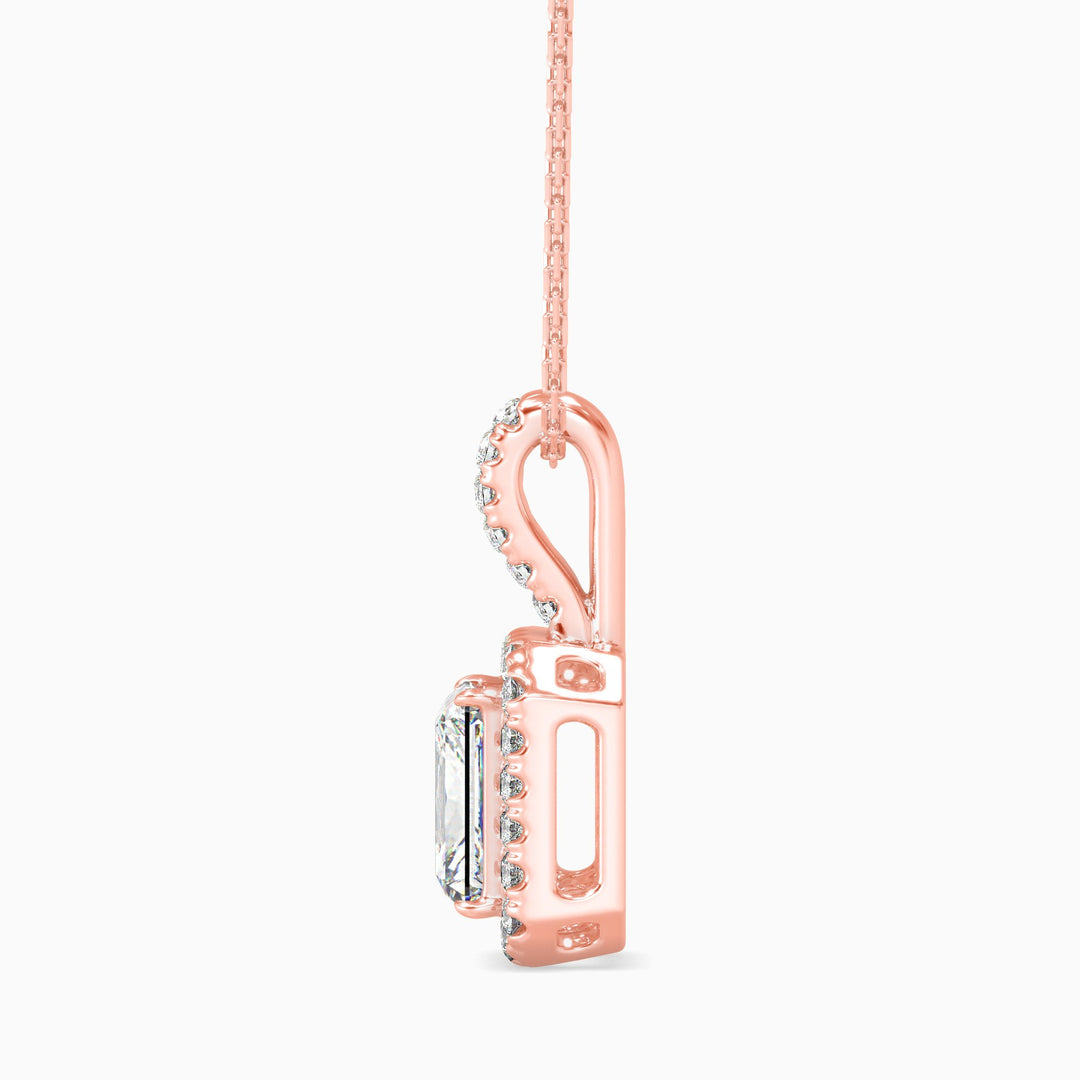 Rose gold pendant with diamonds on a white background