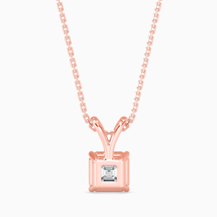 Rose gold necklace with a square-cut diamond pendant on a white background